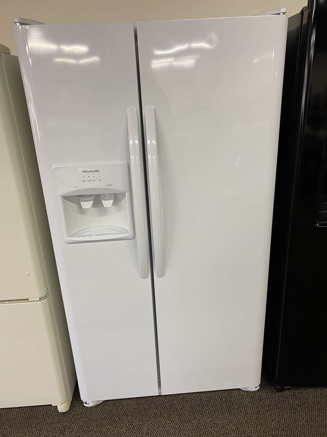 Reconditioned Frigidaire 25.5 cu. ft. Side by Side Refrigerator with Ice and Water Dispenser (White)