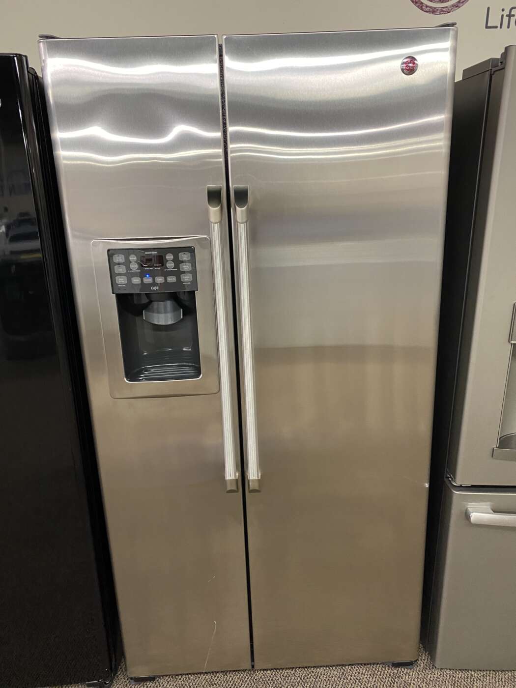 Reconditioned GE 24.6 cu. ft. Side by Side Refrigerator (Stainless Steel)